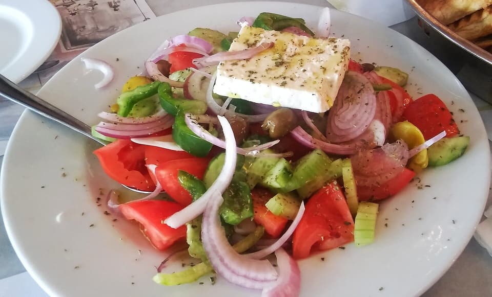 Greek salad with tomato, cucumber, onion, olives and feta (illustrative)